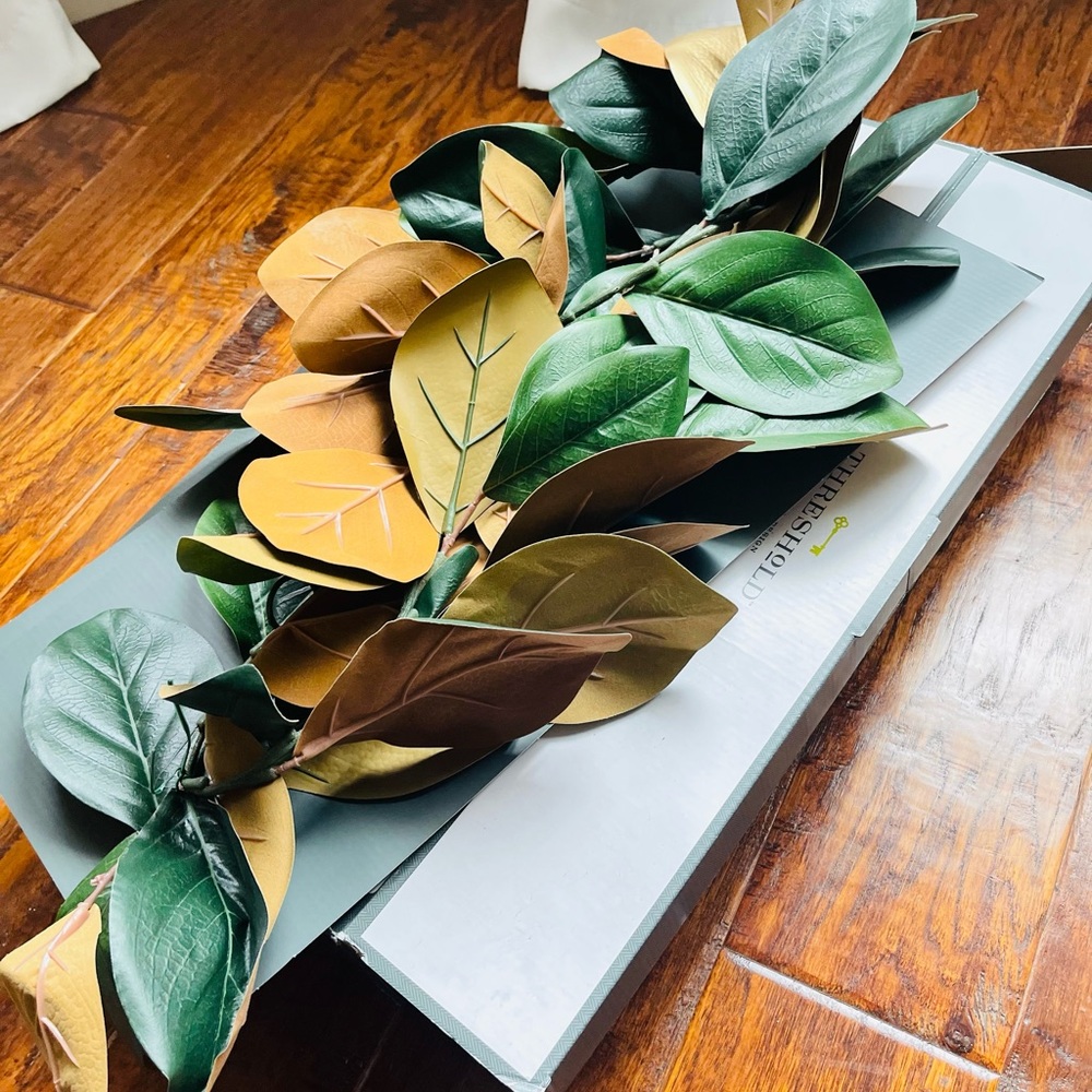 Golden Magnolia Garland by threshold. Size 6 ft